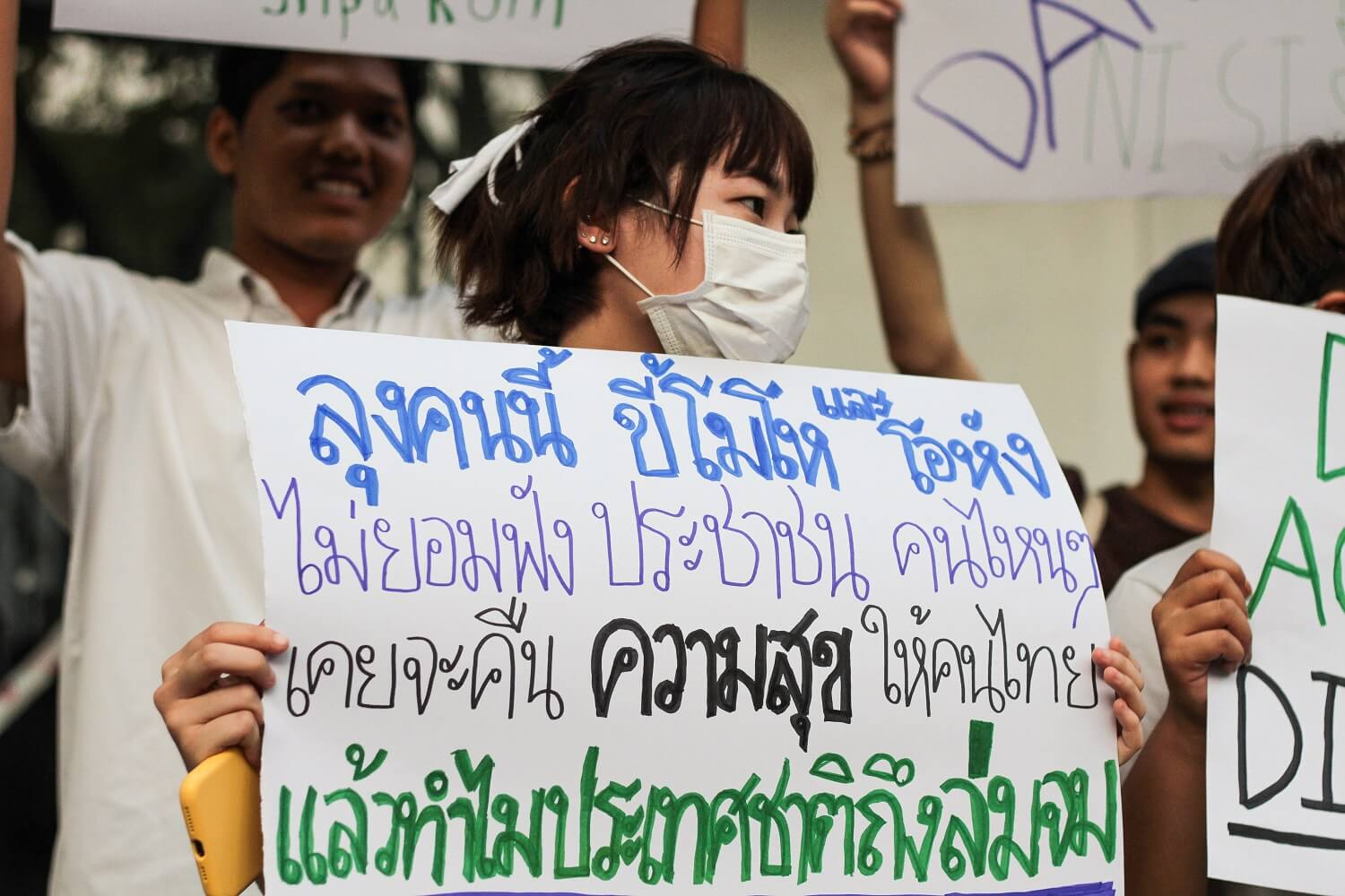 Of Gen. Prayuth, her sign reads: ‘This uncle is hot-headed and aggressive. He doesn’t listen to anyone. He promised to return the happiness to Thais, so then why is the country now ruined?’ 