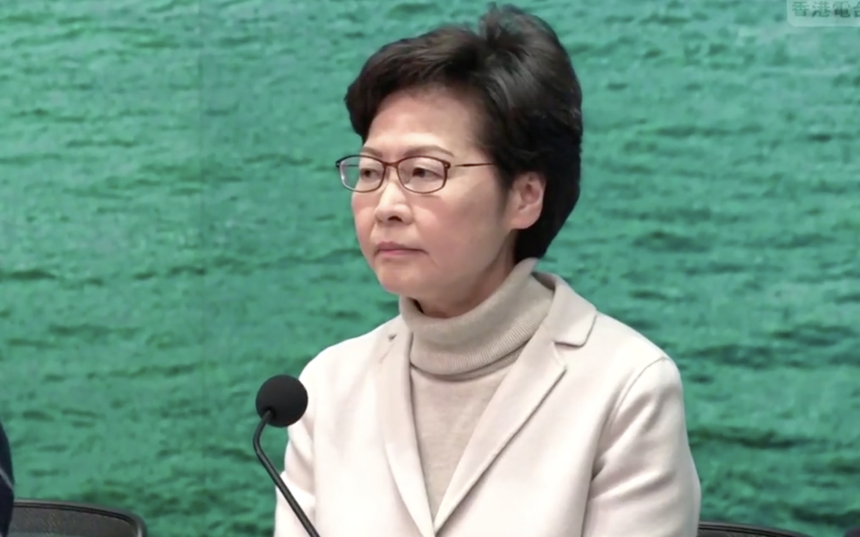 Chief Executive Carrie Lam announces the closure of more border checkpoints into the city after 15 people have been confirmed with the Wuhan coronavirus. Screengrab via Facebook/RTHK.
