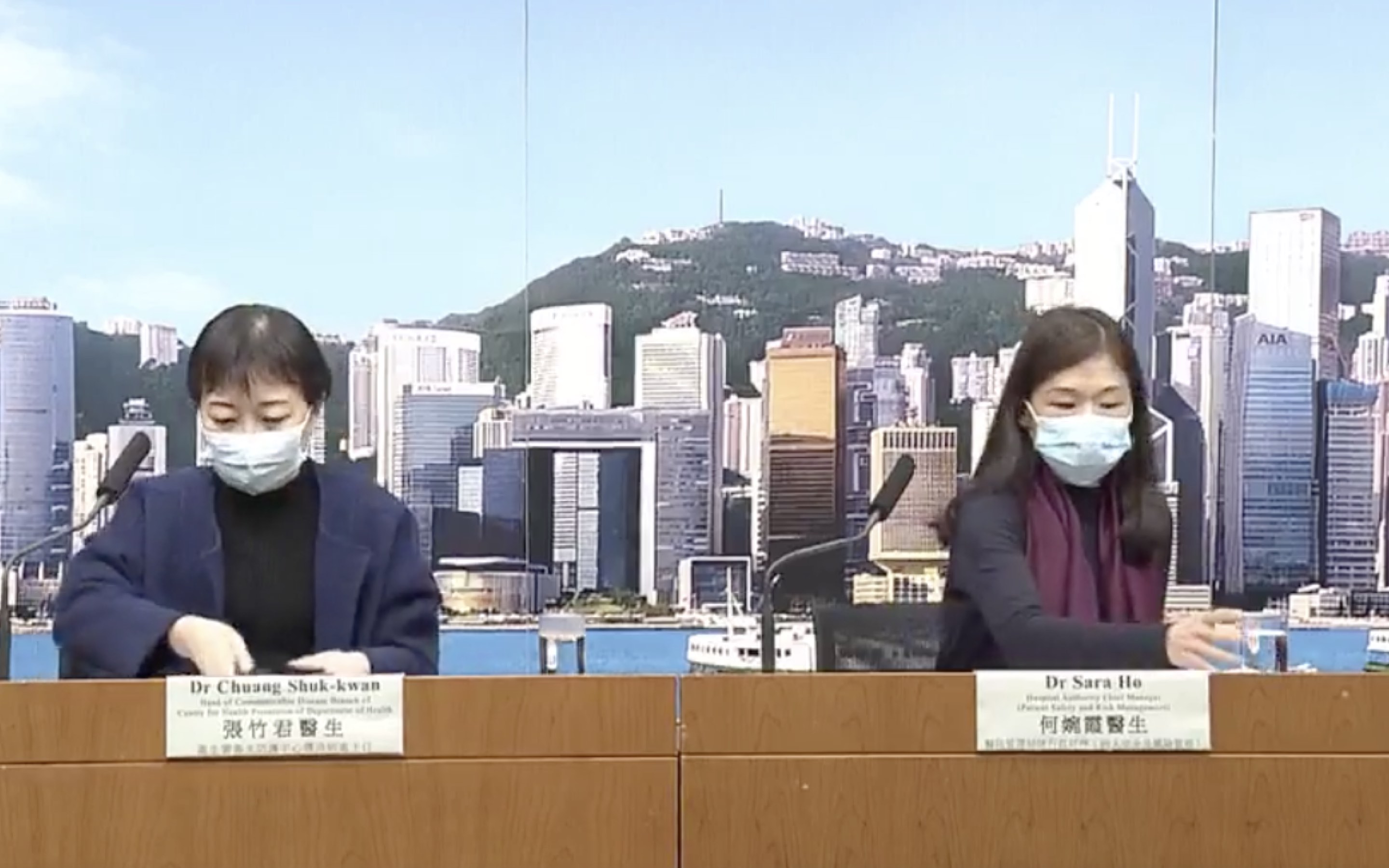 Health officials at a press conference confirming that the first coronavirus patient has been discharged after testing negative. Screengrab via Facebook/Now TV.