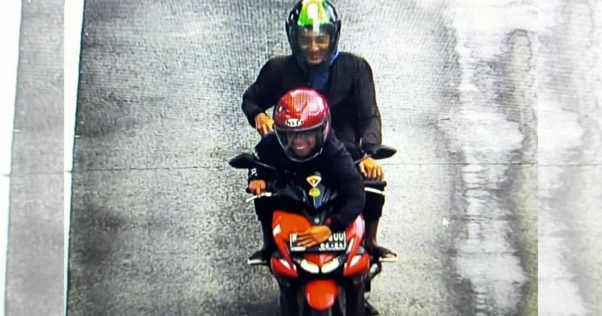 A photo of the traffic violation was caught by an Electronic Traffic Law Enforcement (ETLE) traffic camera, showing a male motorcyclist illegally driving on a TransJakarta bus lane. However, the motorcycle’s license plate was obscured by the driver’s arm, who, along with his passenger in the back, grinned as they pulled off the stunt. Photo: Jakarta Metro Police