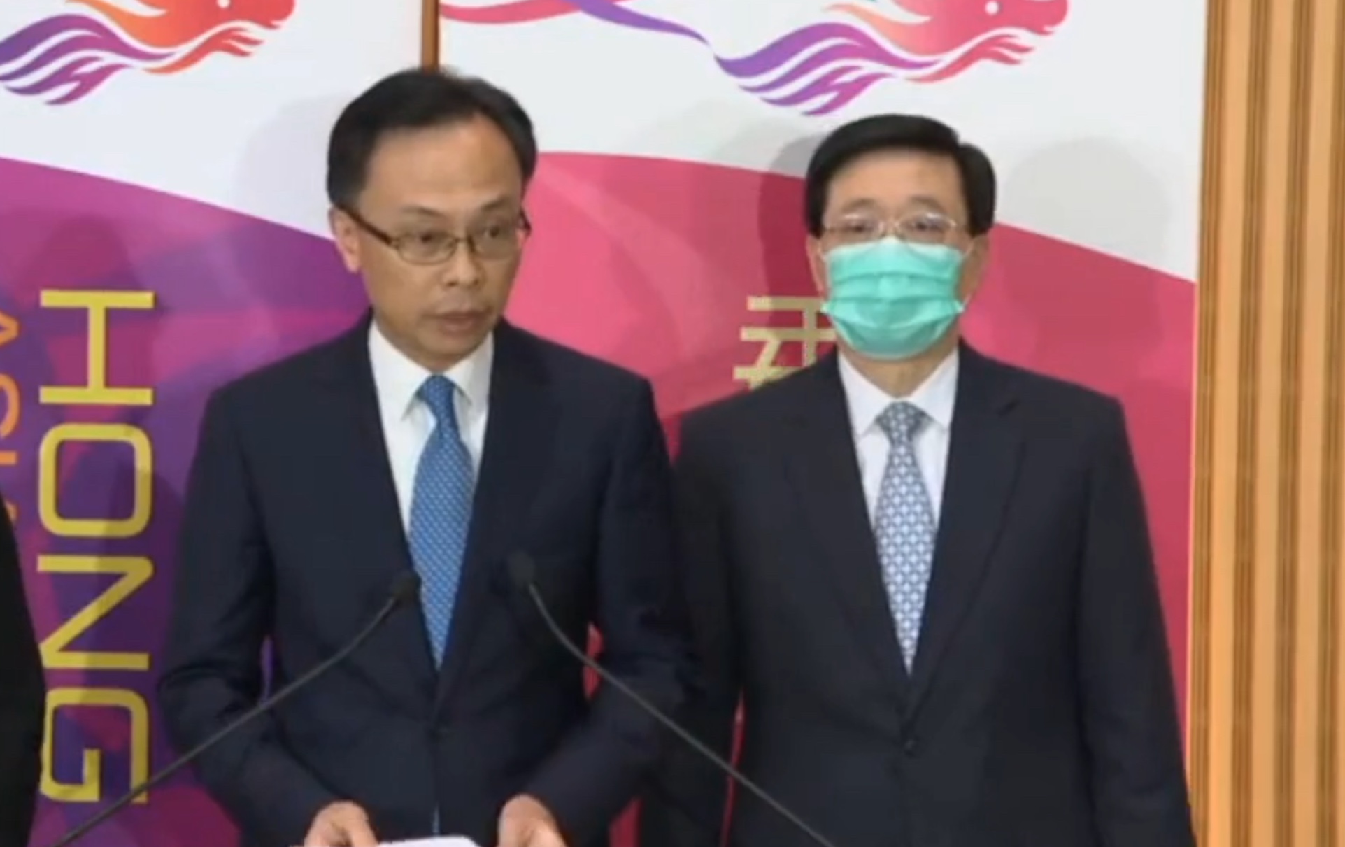 Patrick Nip (left), secretary for constitutional and mainland affairs, and Security Secretary John Lee (right) speak to the media about plans to repatriate Hongkongers stuck in the mainland’s Hubei province, epicenter of the coronavirus outbreak. Screengrab via Facebook.