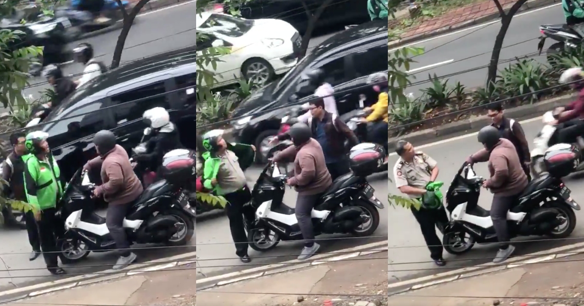 Twitter user Haris Dhiya uploaded a video of a motorcyclist and someone who appears to be an ojol driver for Gojek in the midst of a heated argument, only for the latter to reveal himself as a police officer. Screenshot from Twitter/@hrsdhy