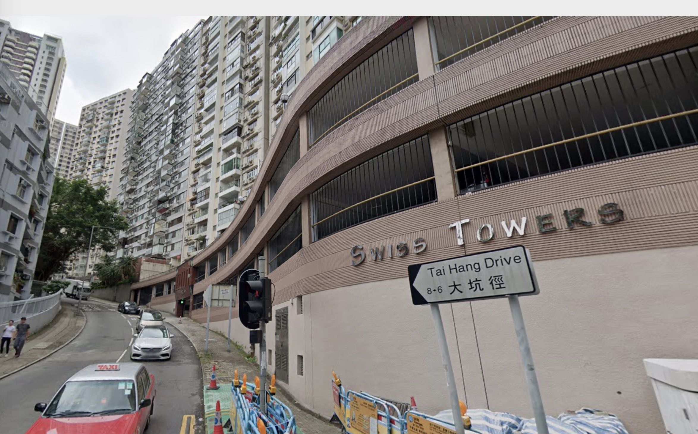 Swiss Towers in Tai Hang, the home of two people — a 60-year-old local woman and a domestic worker — confirmed to have the coronavirus. On Friday officials confirmed that the woman’s pet dog also tested ‘weak positive’ for the virus. Screenshot via Google Maps.