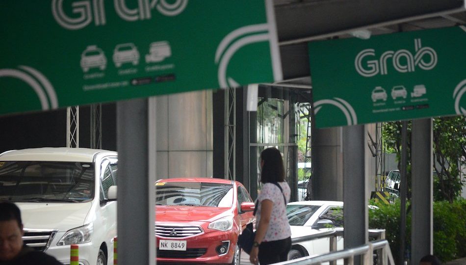 Passengers waiting for a ride in Grab booths in Pasig City <i></noscript>Photo: Mark Demayo / ABS-CBN News</i>
