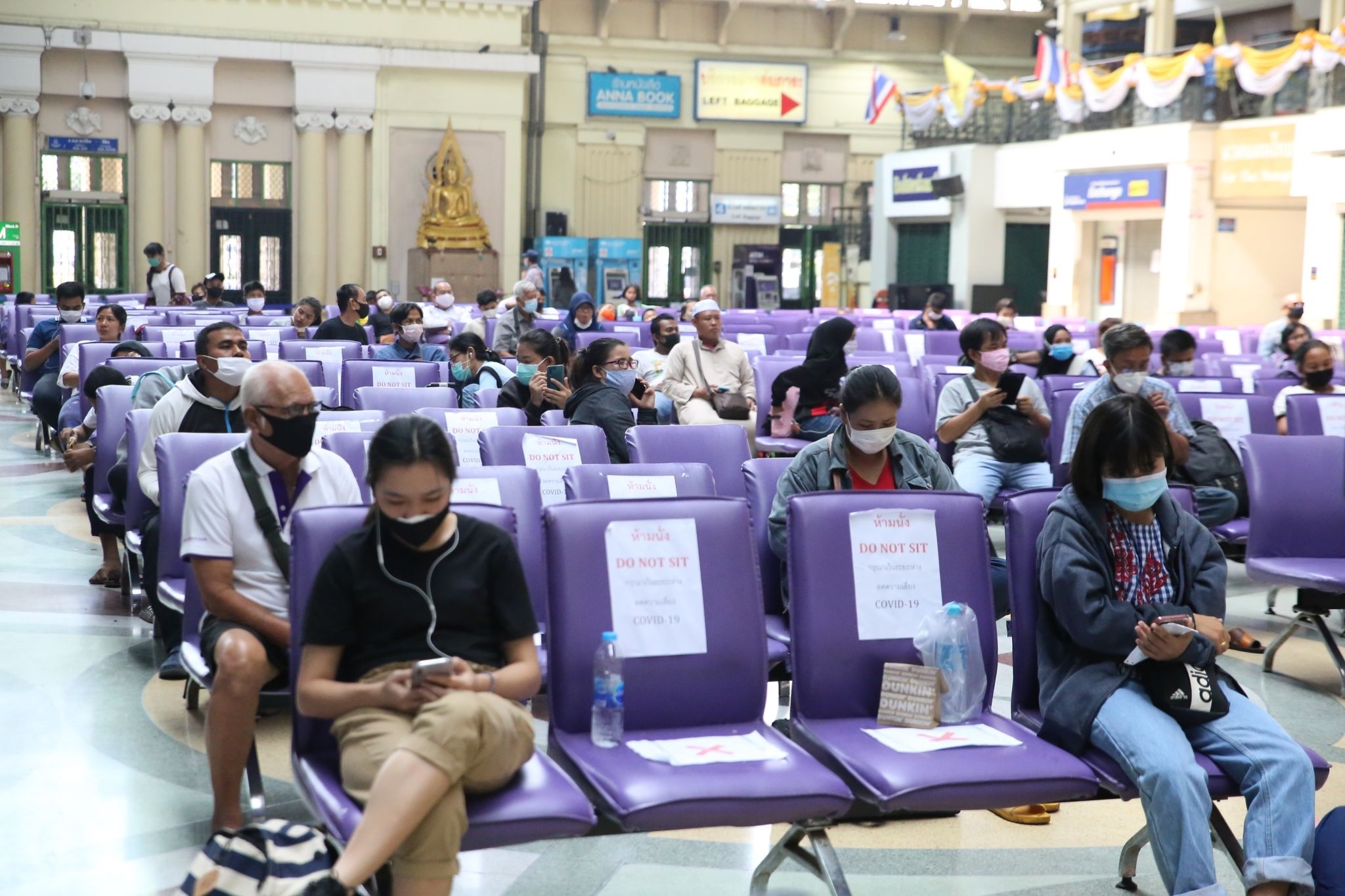 ‘Do not sit,’ read signs enforcing social distancing on chairs at Bangkok’s Hua Lamphong Station. Photo: JS100 Radio
