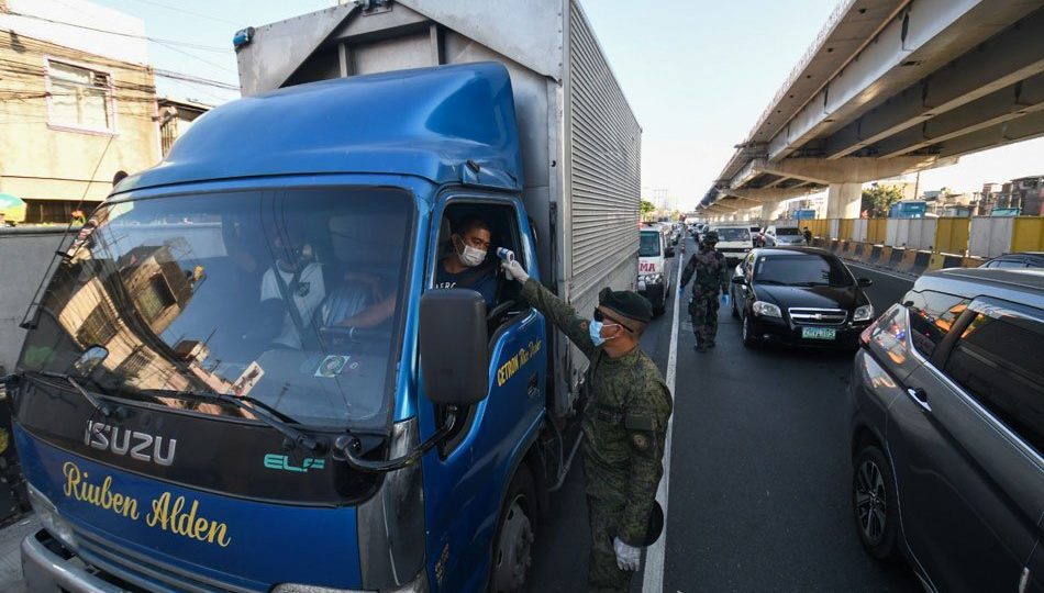 Vehicles pass through a special cargo lane at the North Luzon Expressway on March 19, days after the enhanced community quarantine was implemented. <i></noscript>Photo: Mark Demayo / ABS-CBN News</i>