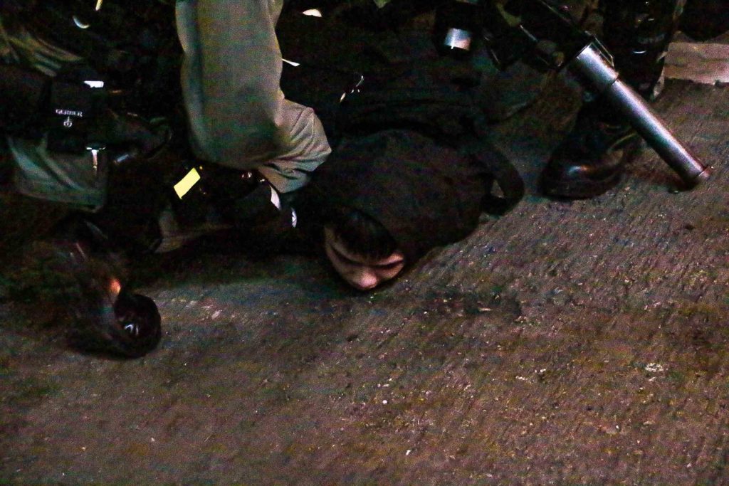A man is arrested during clashes between protesters and police in Mong Kok on Saturday night. Photo by Tommy Walker.