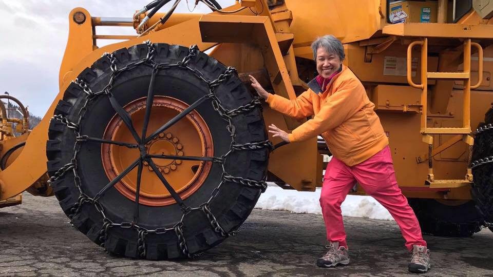 Singaporean first lady Ho Ching with a bulldozer. Photo: Ho Ching/Facebook
