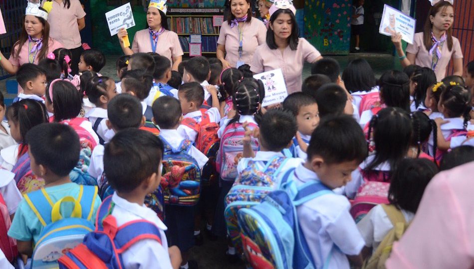 Teachers gather students during the first day of classes at the President Corazon C. Aquino Elementary School in Quezon City on June 5, 2017. <i></noscript>Photo: Mark Demayo, / ABS-CBN News</i>