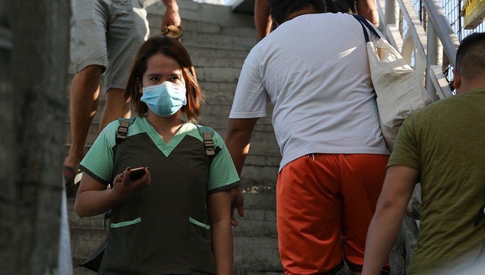 A healthcare worker crosses a bridge in Pasig City shortly after the Luzon lockdown was declared by the government. Photo: Fernando G. Sepe Jr./ABS-CBN News
