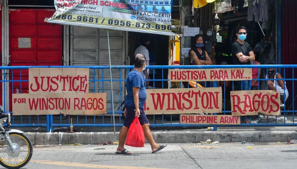 Placards seeking justice for former soldier Winston Ragos. Photo: Mark Demayo/ABS-CBN News
