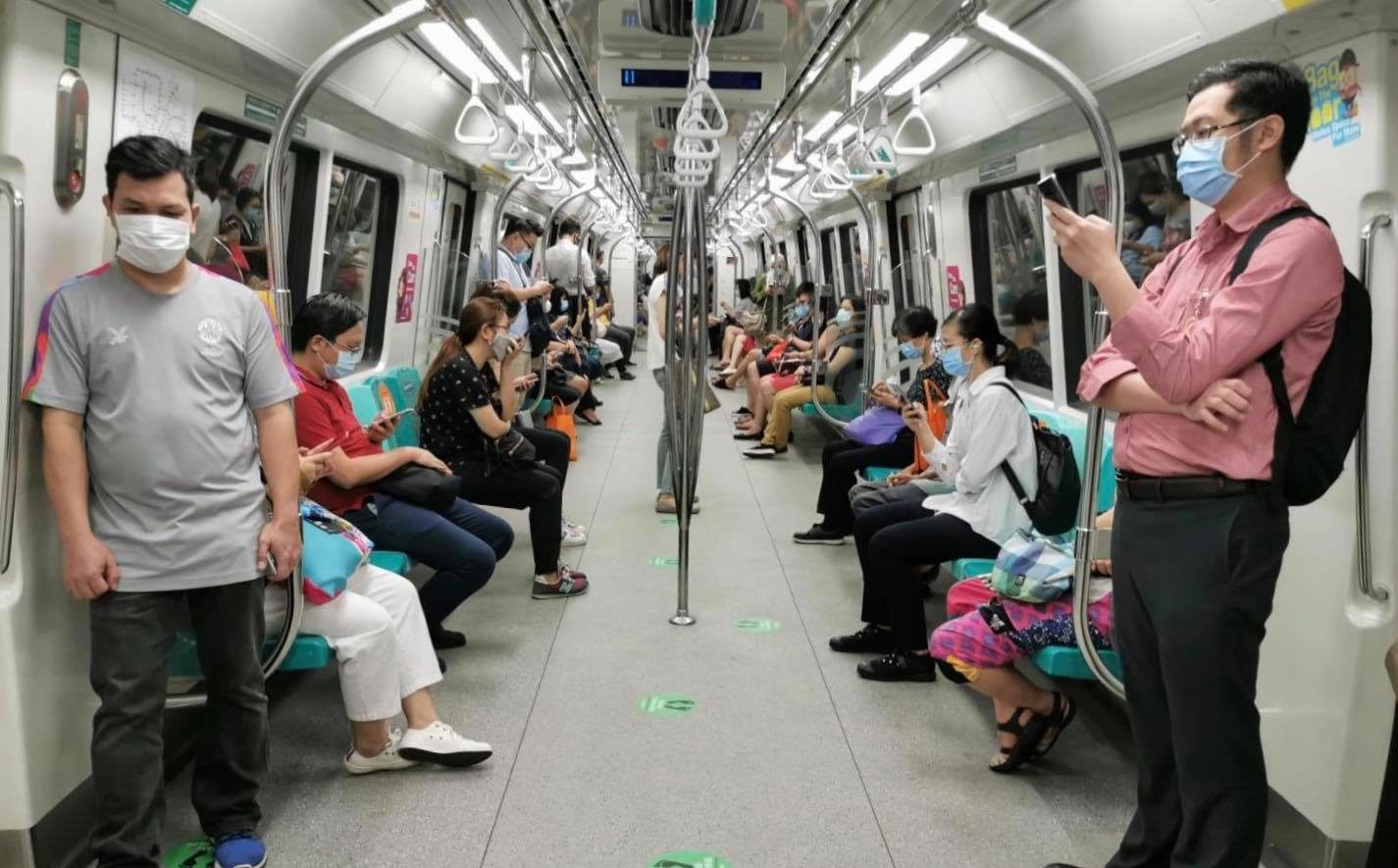 Commuters spread out on a train in Singapore in a photo posted April 20, 2020. Photo: Land Transport Authority/Facebook