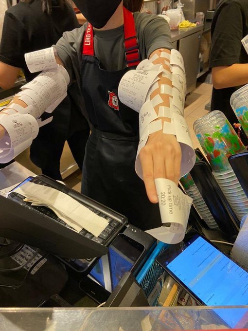 Arms of a Liho bubble tea staff covered with order receipts last night. Photo: All Singapore Stuff/Facebook