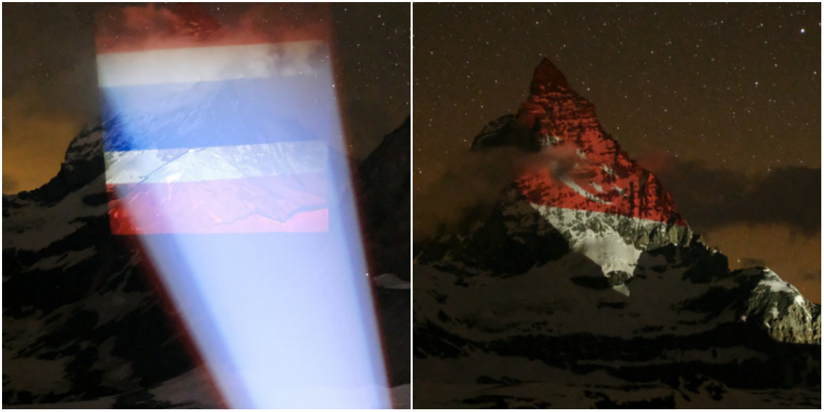 At left, the Thai flag with Singapore’s flag at right, as projected onto Switzerland’s Matterhorn early this morning. Photos: MySwitzerlandSEA/Facebook
