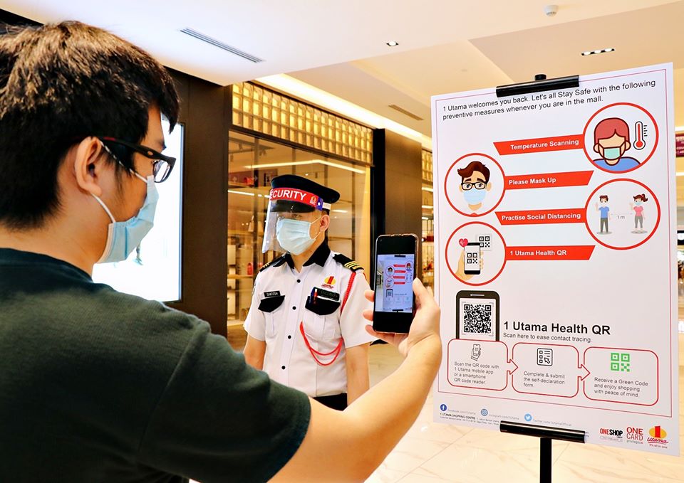 Visitor downloading Health QR app. Photo: 1 Utama Shopping Centre