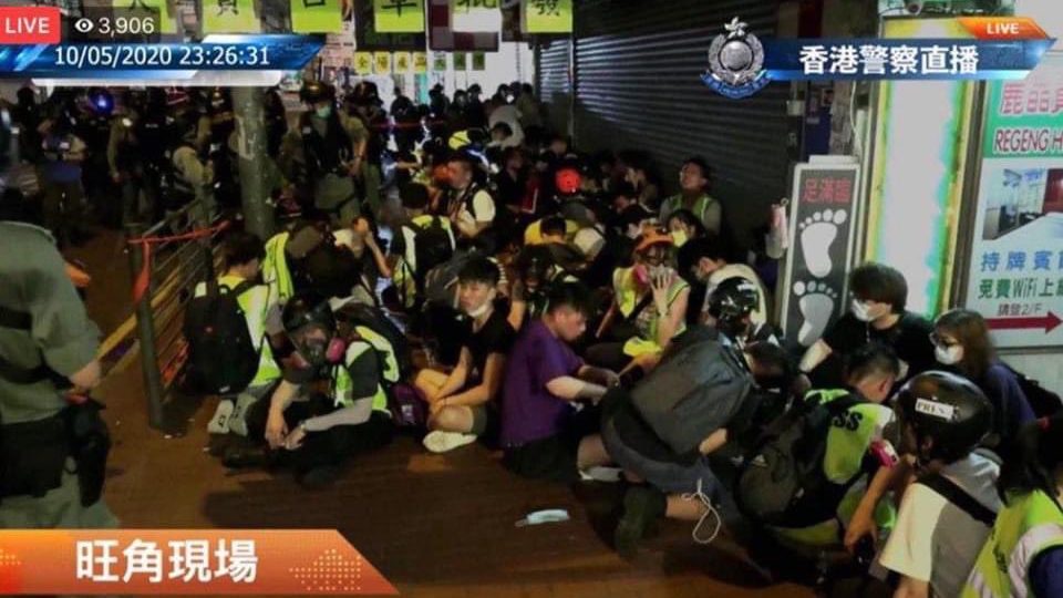A group of journalists, who were clearly wearing high-vis neon vests, were detained by police while they reported on the protest in Mong Kok on Sunday night. Screengrab: Hong Kong Police Force via Facebook