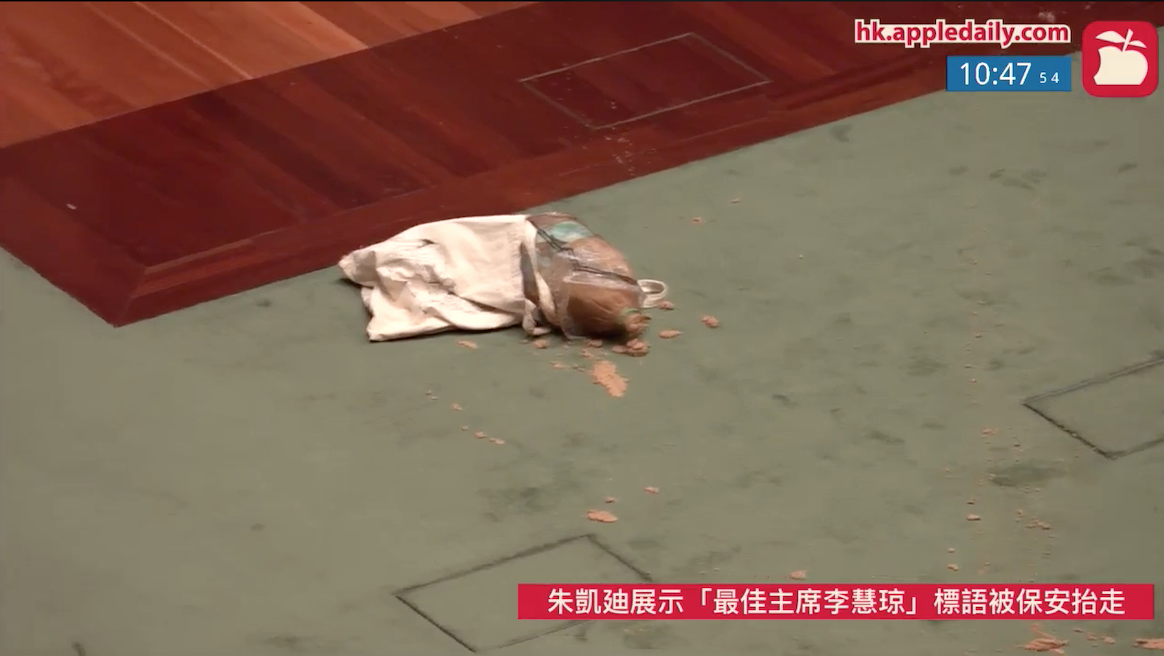 A brown bag with a foul-smelling odor is left on the floor of the Legislative Council meeting chamber on May 28, 2020. Photo: Apple Daily live feed