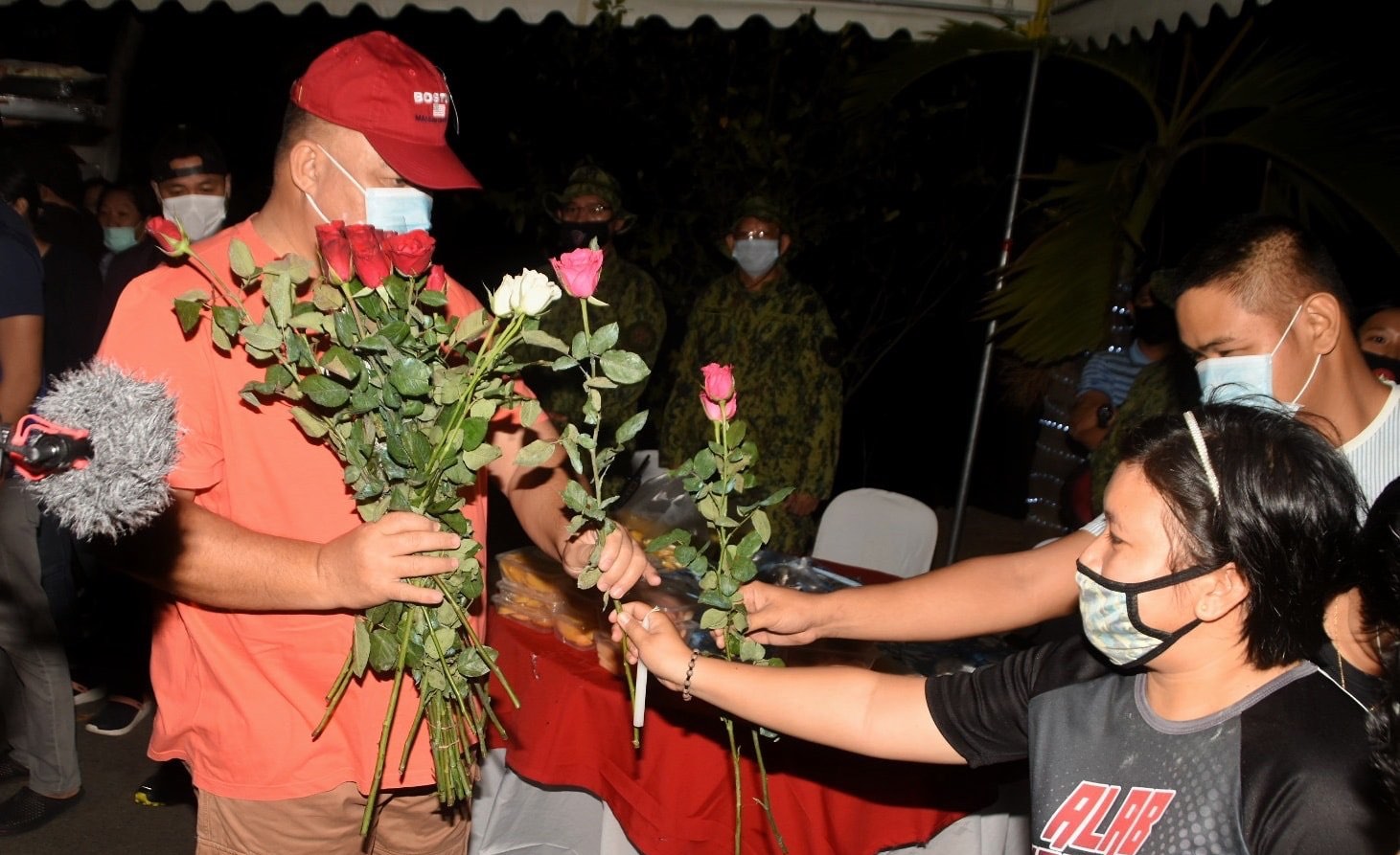 NCRPO Chief Debold Sinas accepts roses from staff during birthday event <i></noscript>Photo: NCRPO / FB</i>