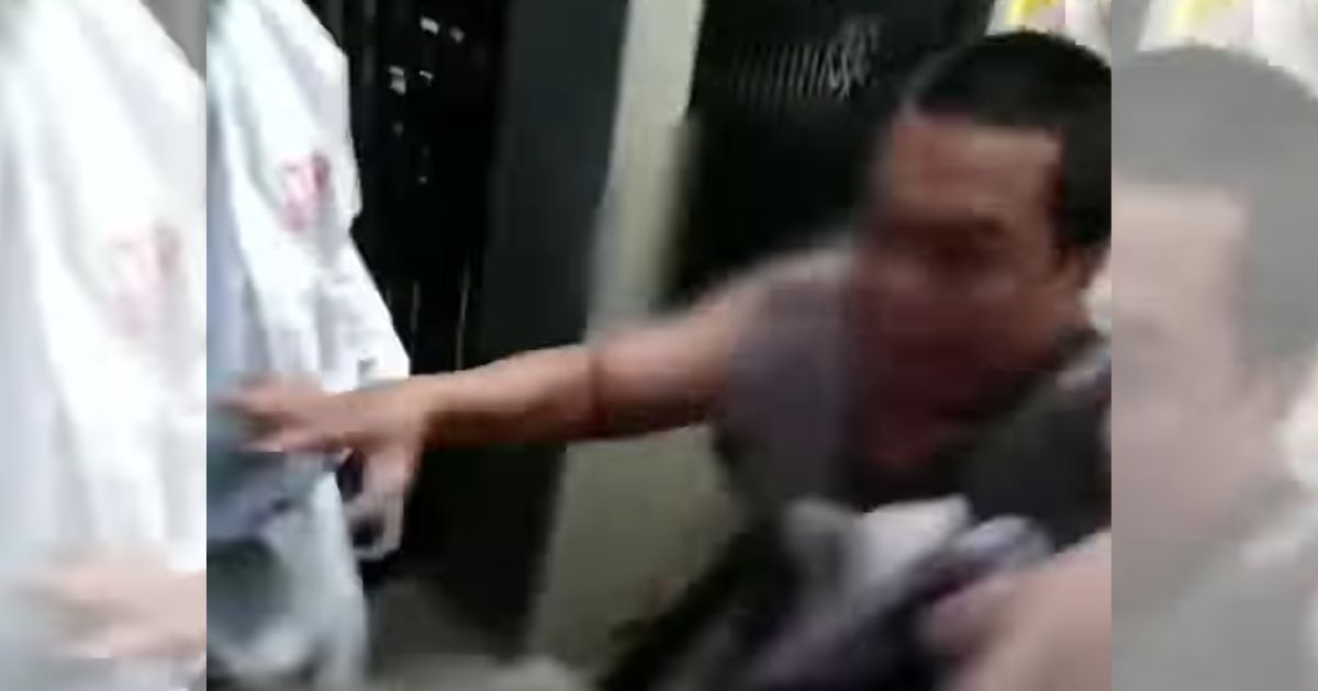Screenshot from a viral video showing a 40-year-old man in Tasikmalaya, West Java who was tested positive for COVID-19 refused to be hauled to a hospital and went as far as purposely hugging his neighbor in an apparent attempt to spread the infection. 
