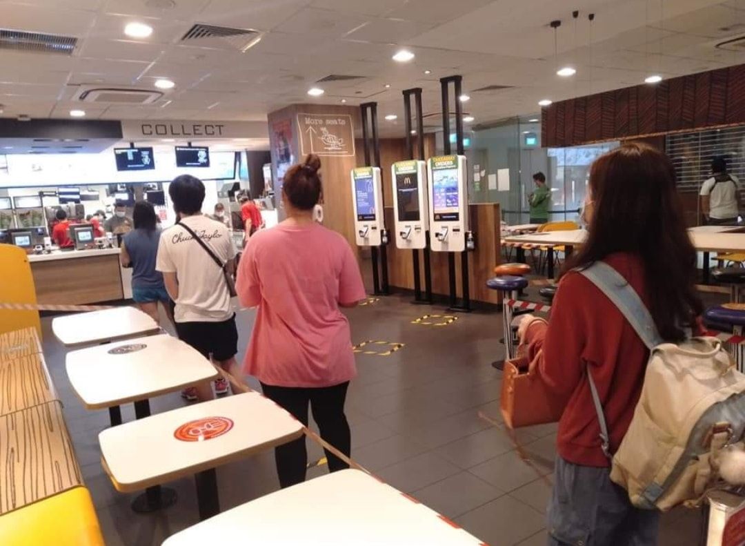 Customers queue at a McDonald’s outlet today. Photo: Legit Singapore/Facebook