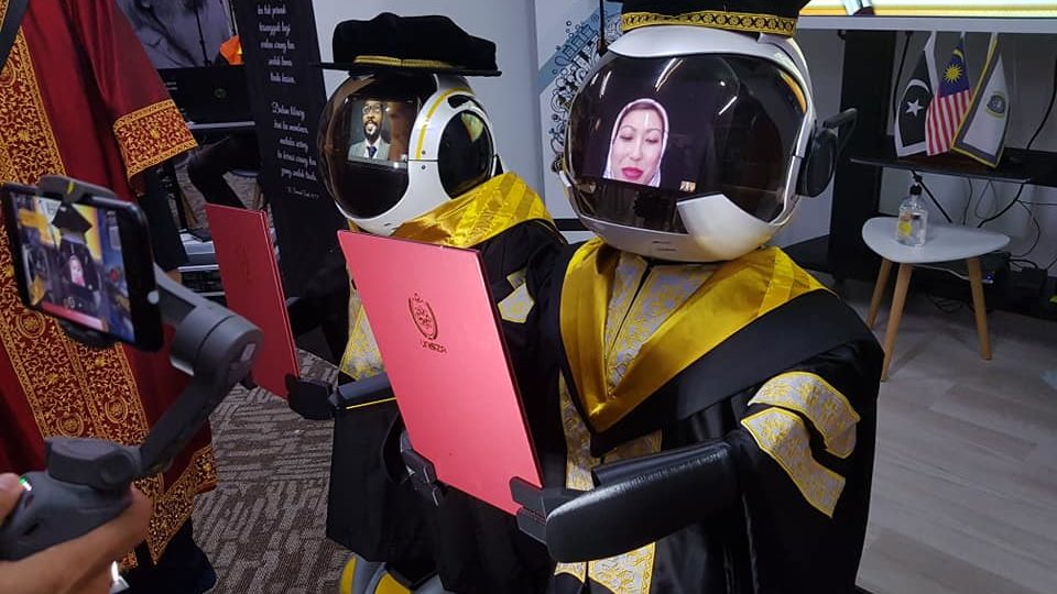 Robot graduates receiving their academic documents. Photo: Universiti Sultan Zainal Abidin / Facebook