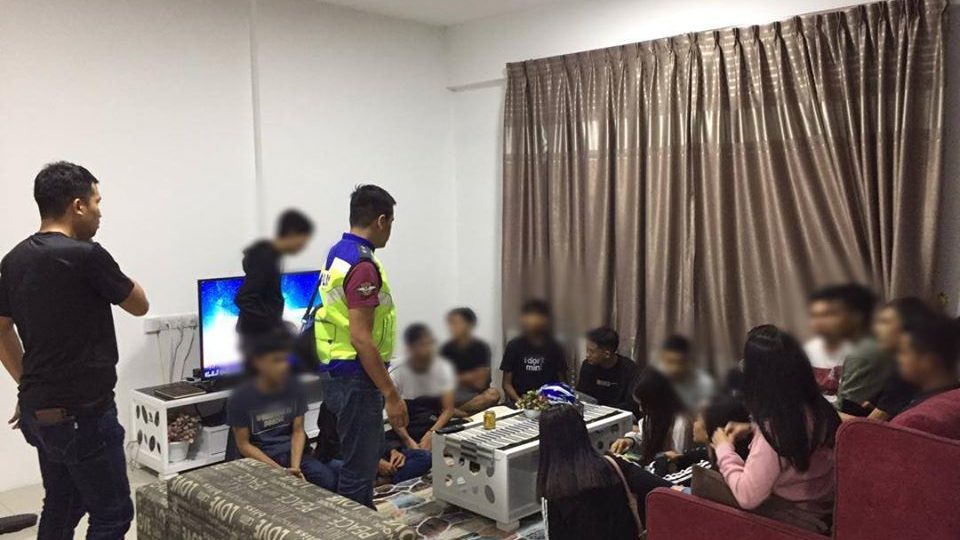 Police officials raid alleged illegal gathering in Ipoh. Photo: Perak Gazette / Facebook