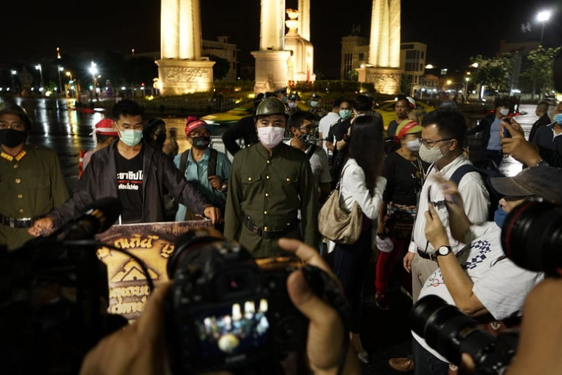 Protesters, some in costume, rally early Wednesday morning at the Democracy Monument to commemorate the 1932 revolt that brought democracy to Thailand. Photo: Democracy Restoration Group
