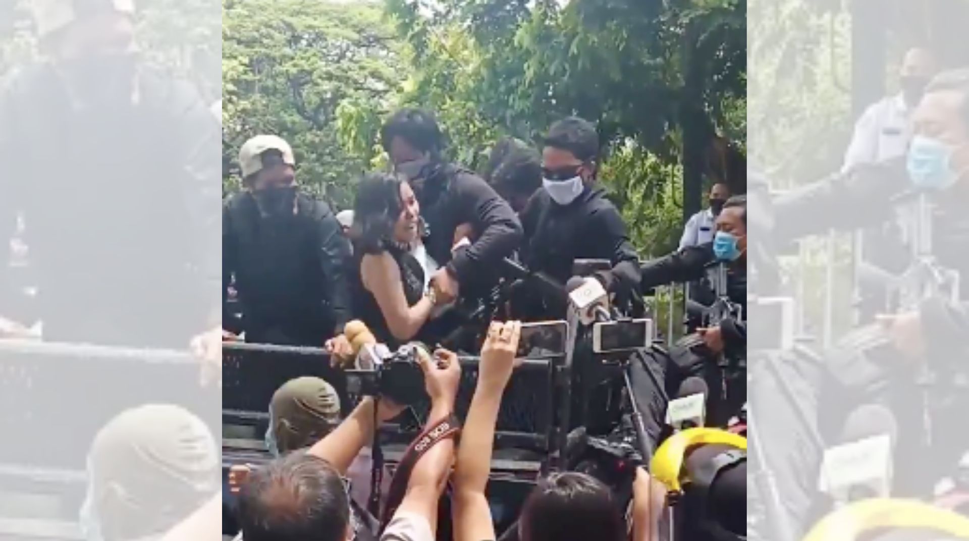 Activist Dyan Gumanao resists arrest as she’s hauled in a truck by police forces in Cebu City <i></noscript>Photo: CEGP Cebu / FB</i>