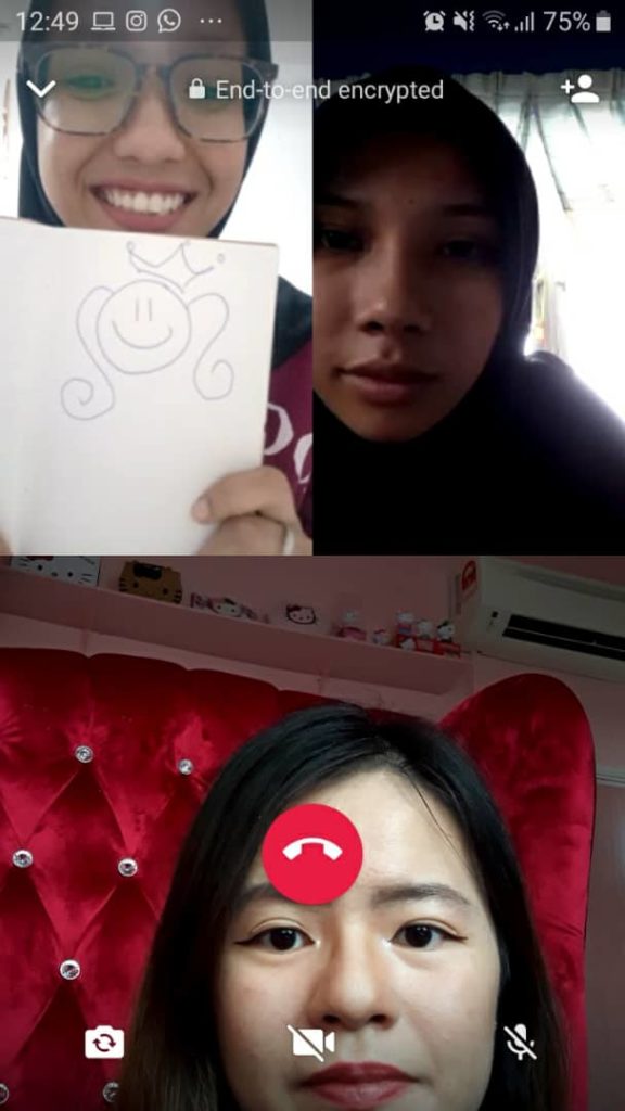 Amiera (top left) shows the childhood doodle that inspired Owh My Bae’s logo to chatbot user Nureen Firzana (top right) and Coconuts KL editor. Photo: Coconuts KL