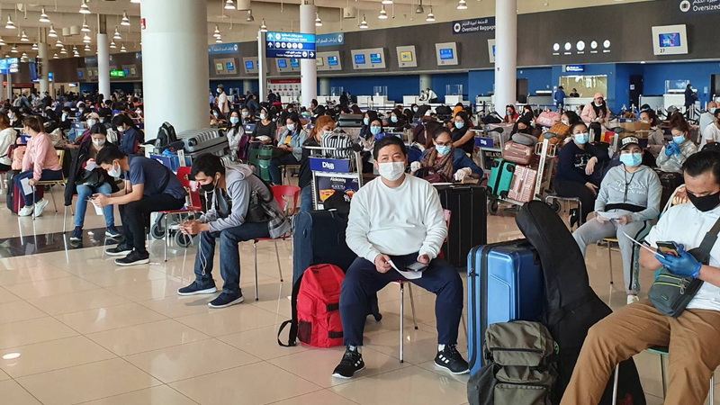 Thai travelers wait for flights home Monday at Dubai International Airport. Photo: Royal Thai Consulate-General, Dubai