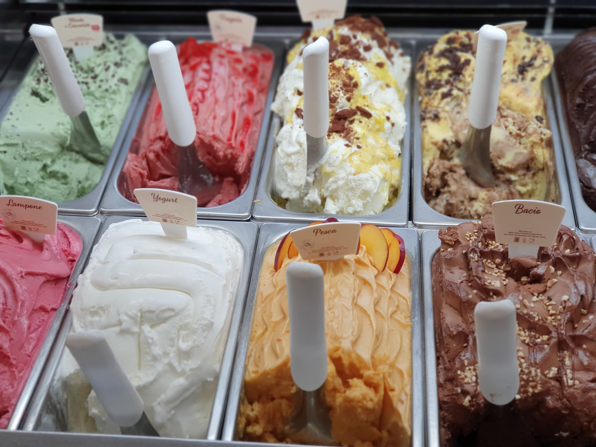 Ice cream on display at a dessert shop. Photo via Unsplash/@lamaroscu