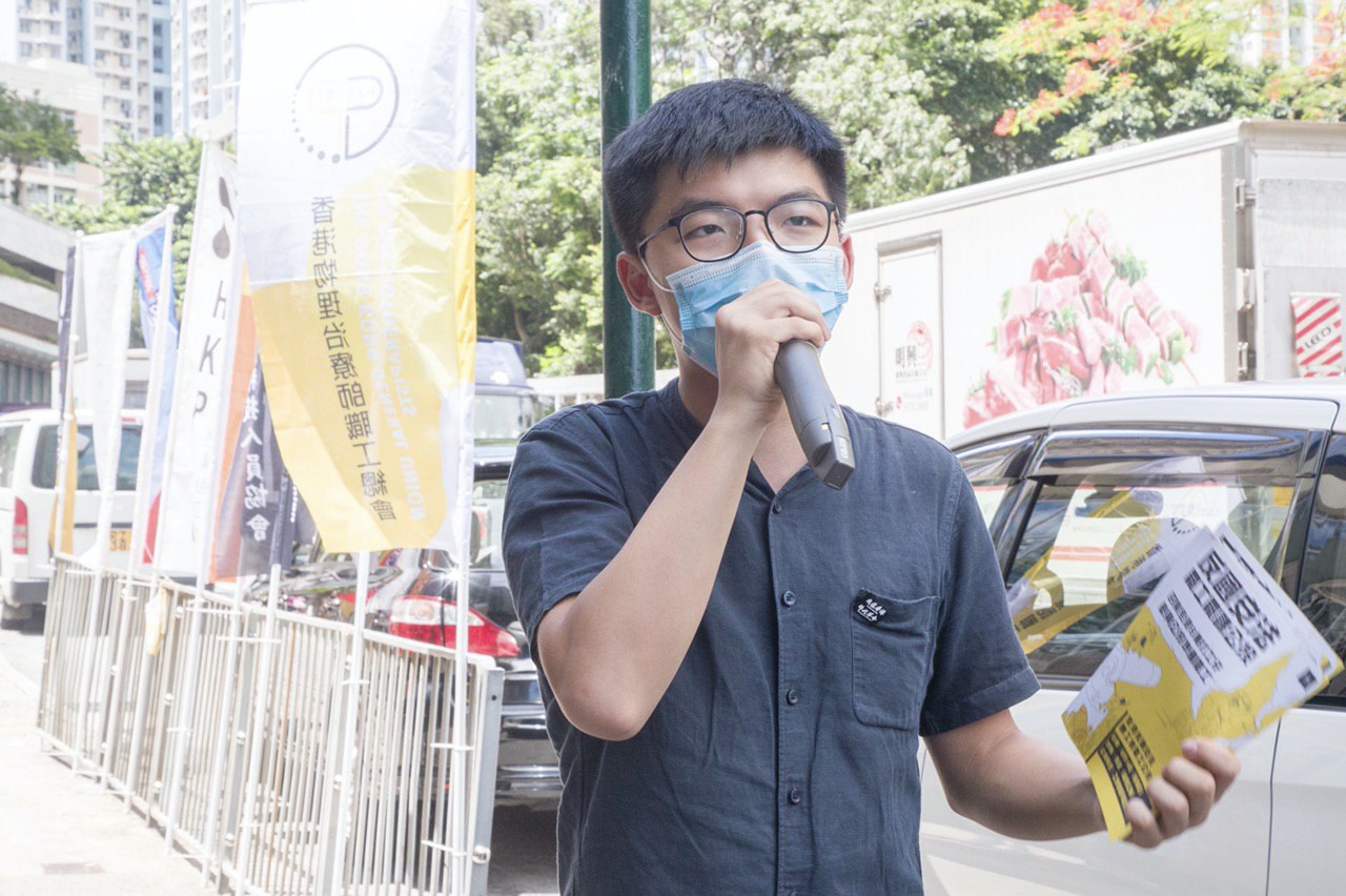 Hong Kong pro-democracy activist Joshua Wong hands out leaflets in Wong Tai Sin on June 20, 2012. Photo via Facebook/Joshua Wong