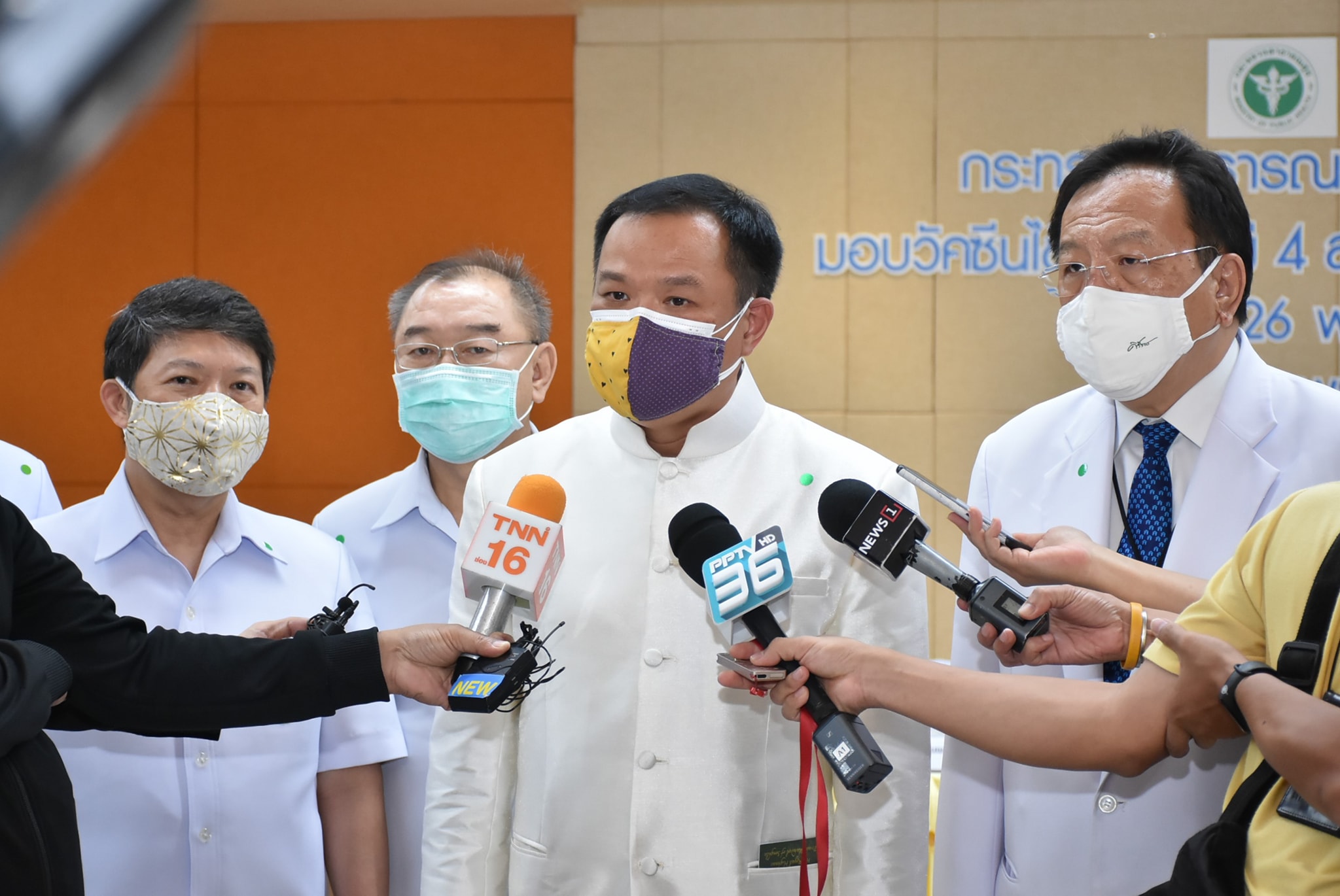 Public Health Minister Anutin Charnvirakul, at center, is being interviewed by the media. Photo: Department of Disease Control / Facebook

