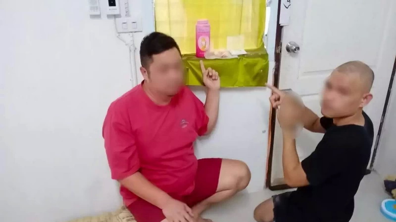 Jitraboon Pichienpak, the adult son of veteran actor Anusorn Dechapunya, at left, poses for the police with another suspect and their alleged contraband.