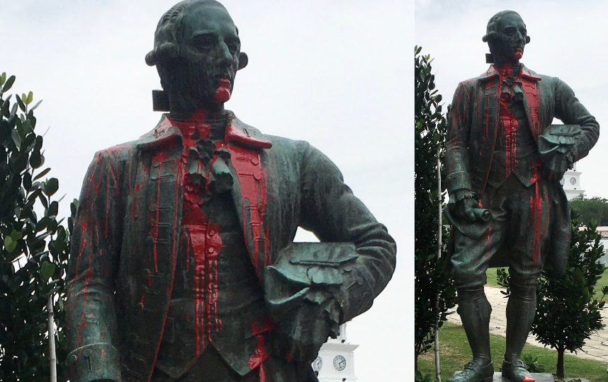The statue of Francis Light splashed from head to toe with red paint. Photos: Antifa M /Twitter
