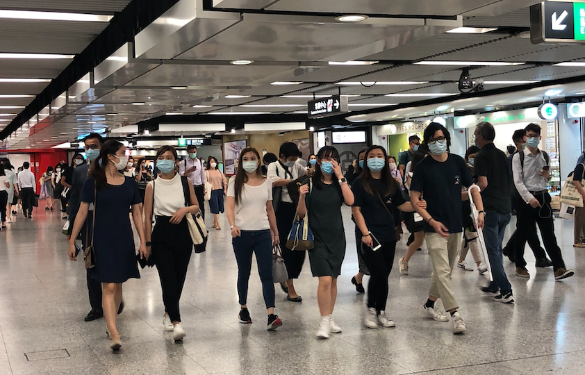 Commuters walk through Central MTR station on July 9, 2020. Photo: Coconuts Media