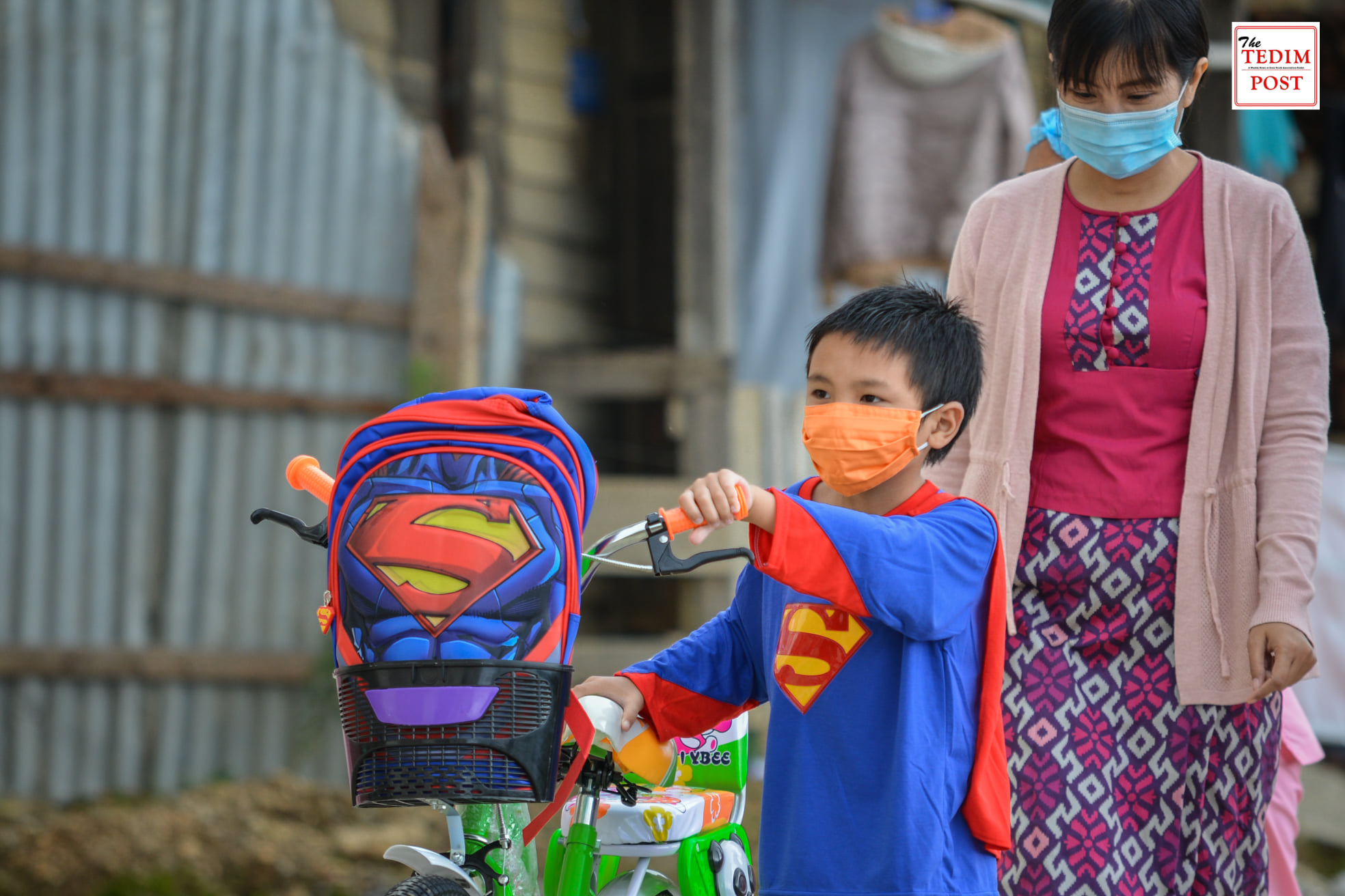 Nurses and doctors applaud him as he walks out of the hospital, some help him with the bicycle he just received and a superman kid backpack. By “him,” we mean a 6-year-old boy with a Superman costume given as a gift by Tedim General Hospital in Chin State.