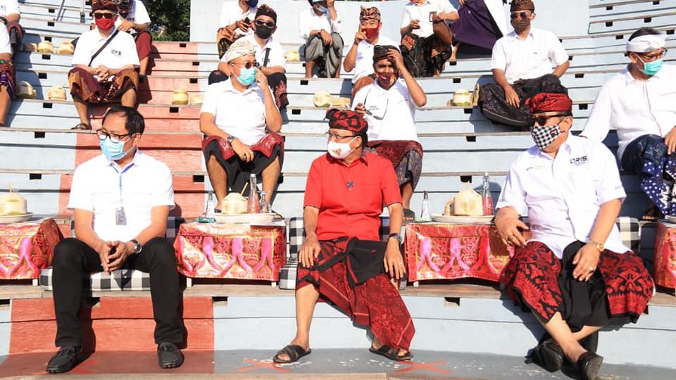 Bali Governor Wayan Koster, in red shirt, with other Bali officials attending an event in Uluwatu last week. Photo: Bali Provincial Government