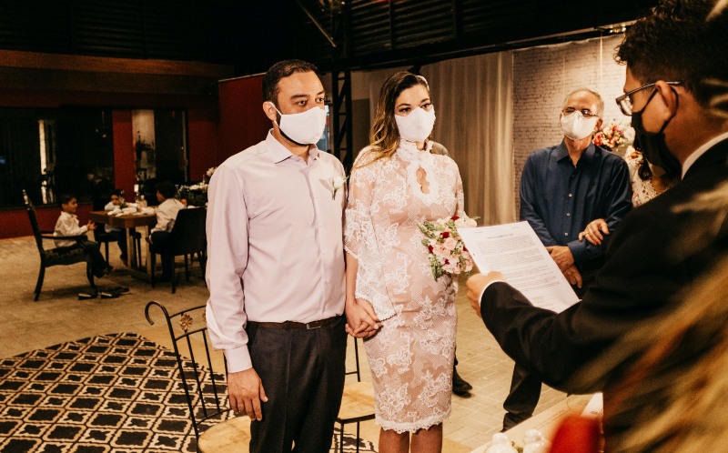 File photo of a wedding ceremony in which the attendees are wearing face masks. Photo: Jonathan Borba
