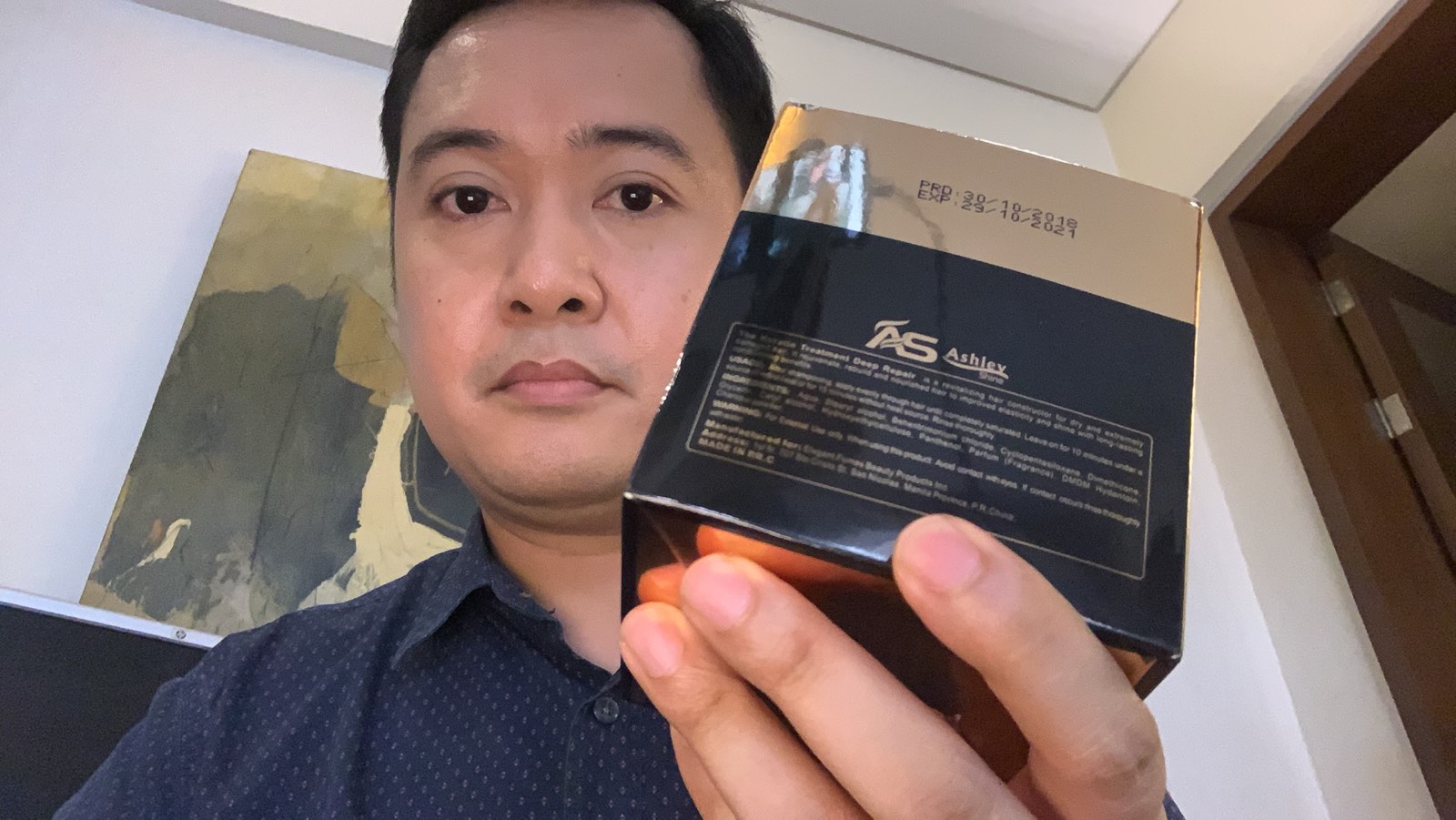Congressman Jericho Nograles holds a box of offending Chinese-made hair product <i></noscript>Photo via Twitter</i>