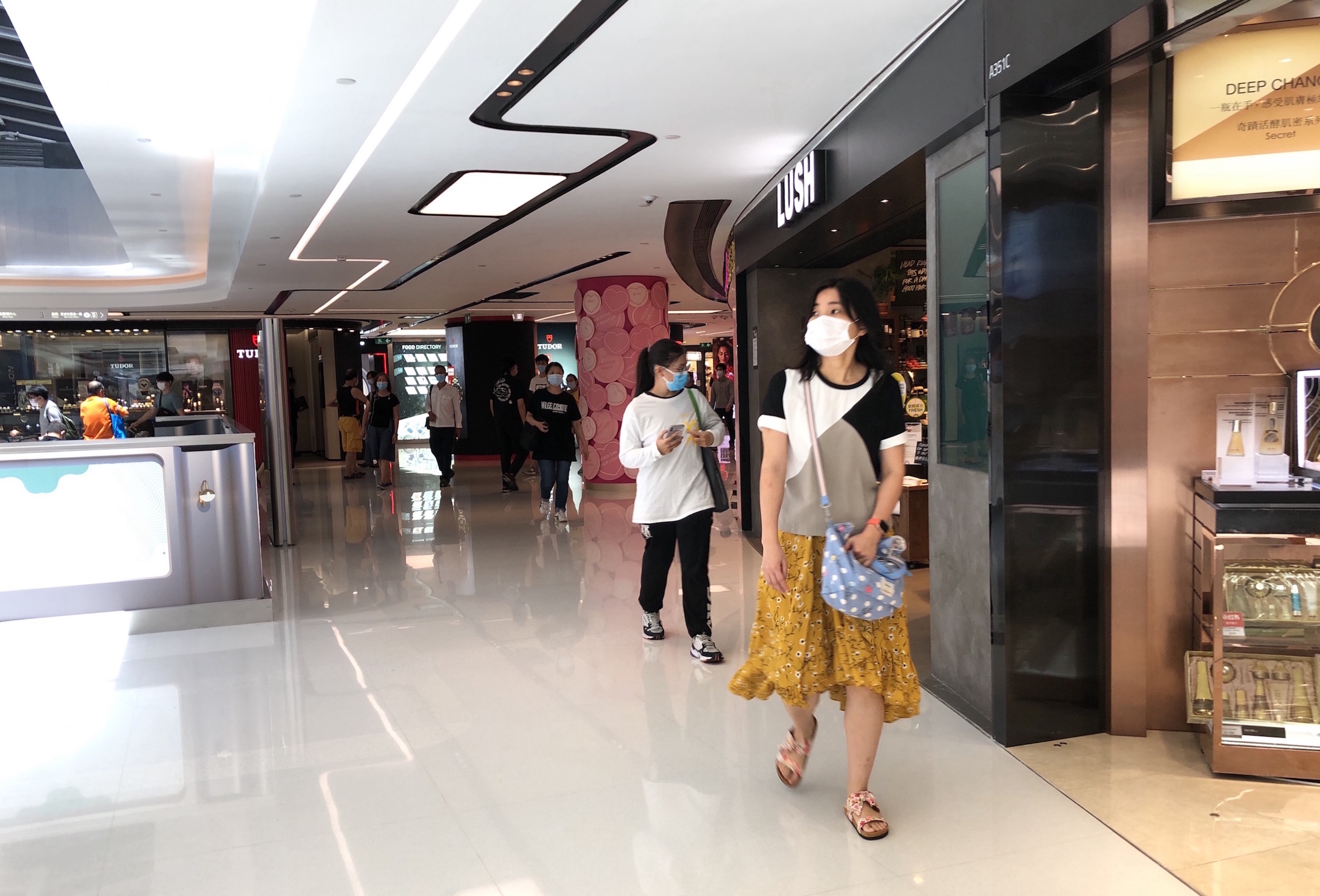 Shoppers walk in New Town Plaza Phase 3 in Sha Tin on Aug. 12, 2020.
