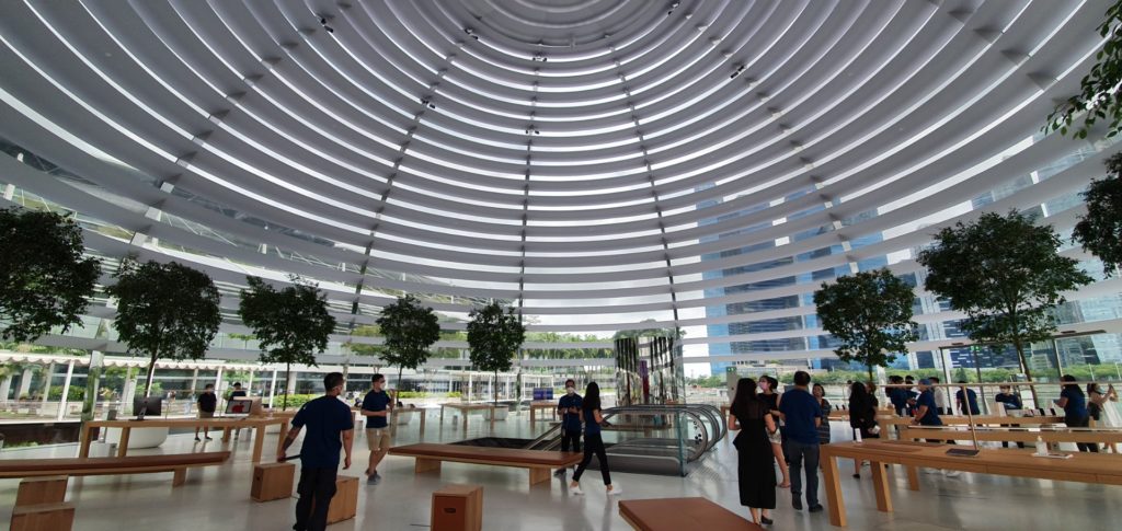 Guides showing visitors around the Apple store. Photo: Coconuts Singapore
