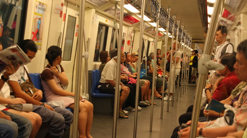 File photo of passengers aboard an MRT train.  Photo: Matthew Klein / Flickr