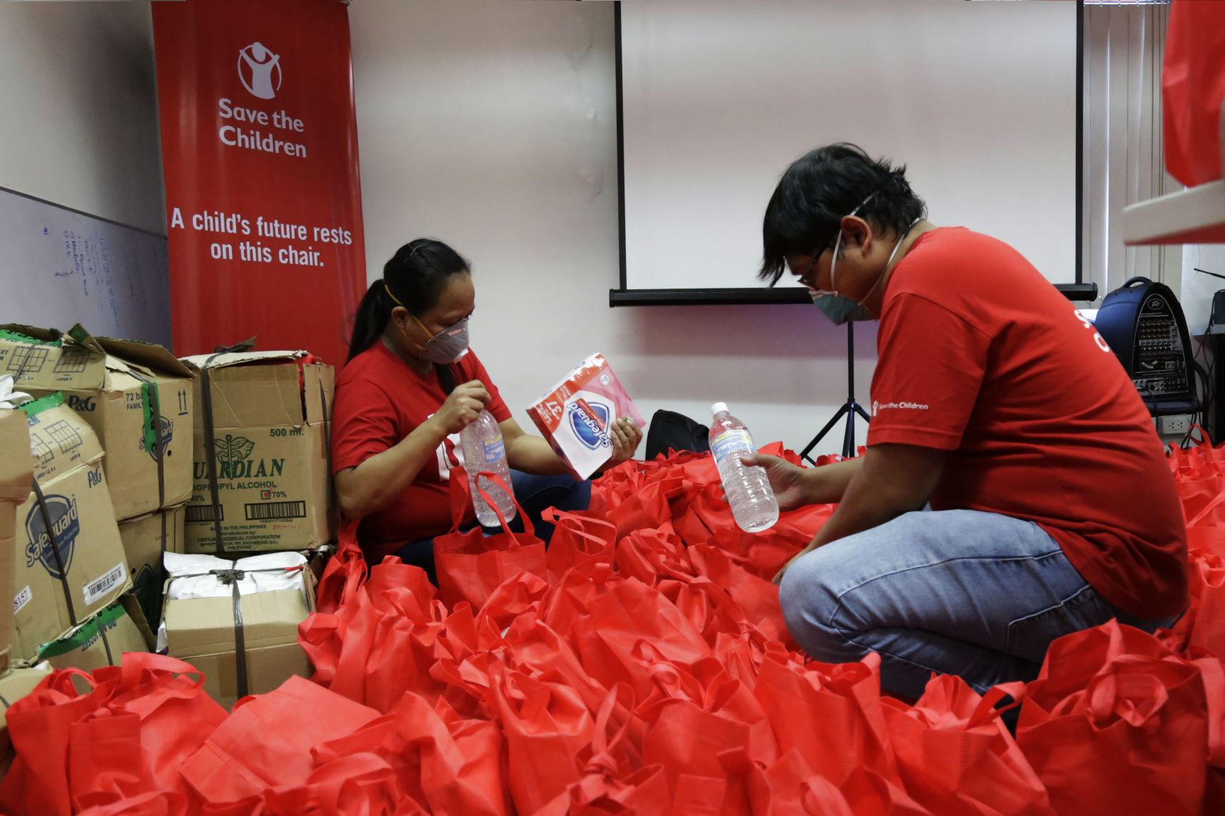 Staff prepare relief goods in Navotas, Metro Manila. Photo: Save the Children