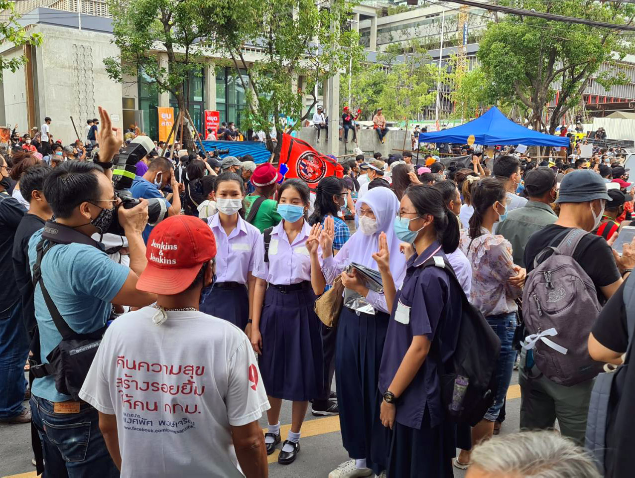 Protesters gather Thursday outside the new, unfinished parliament building. Photo: Coconuts