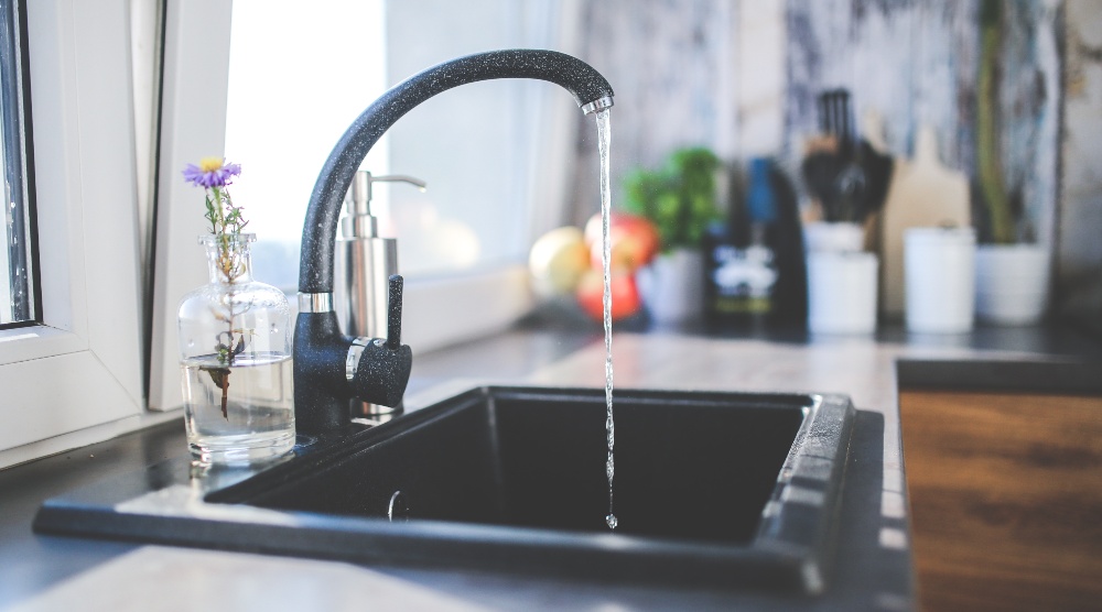 File photo of water flowing out of a tap. Photo: Kaboompics.com
