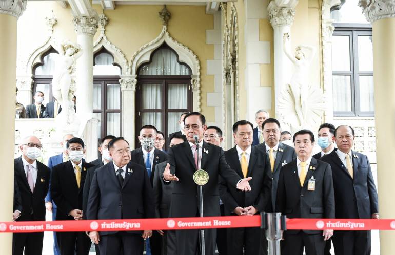 Prayuth Chan-o-cha, at microphone, flanked by members of his cabinet today at the Government House in Bangkok. Photo: Thai Government 