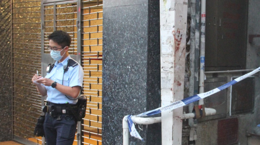 A bloody handprint was left outside the building. Photo via Apple Daily