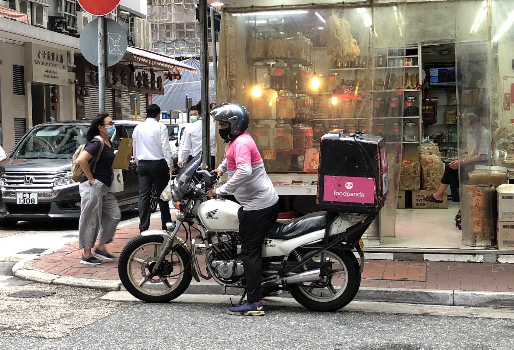 A Foodpanda driver delivers a food order in Sheung Wan. Photo: Coconuts Media