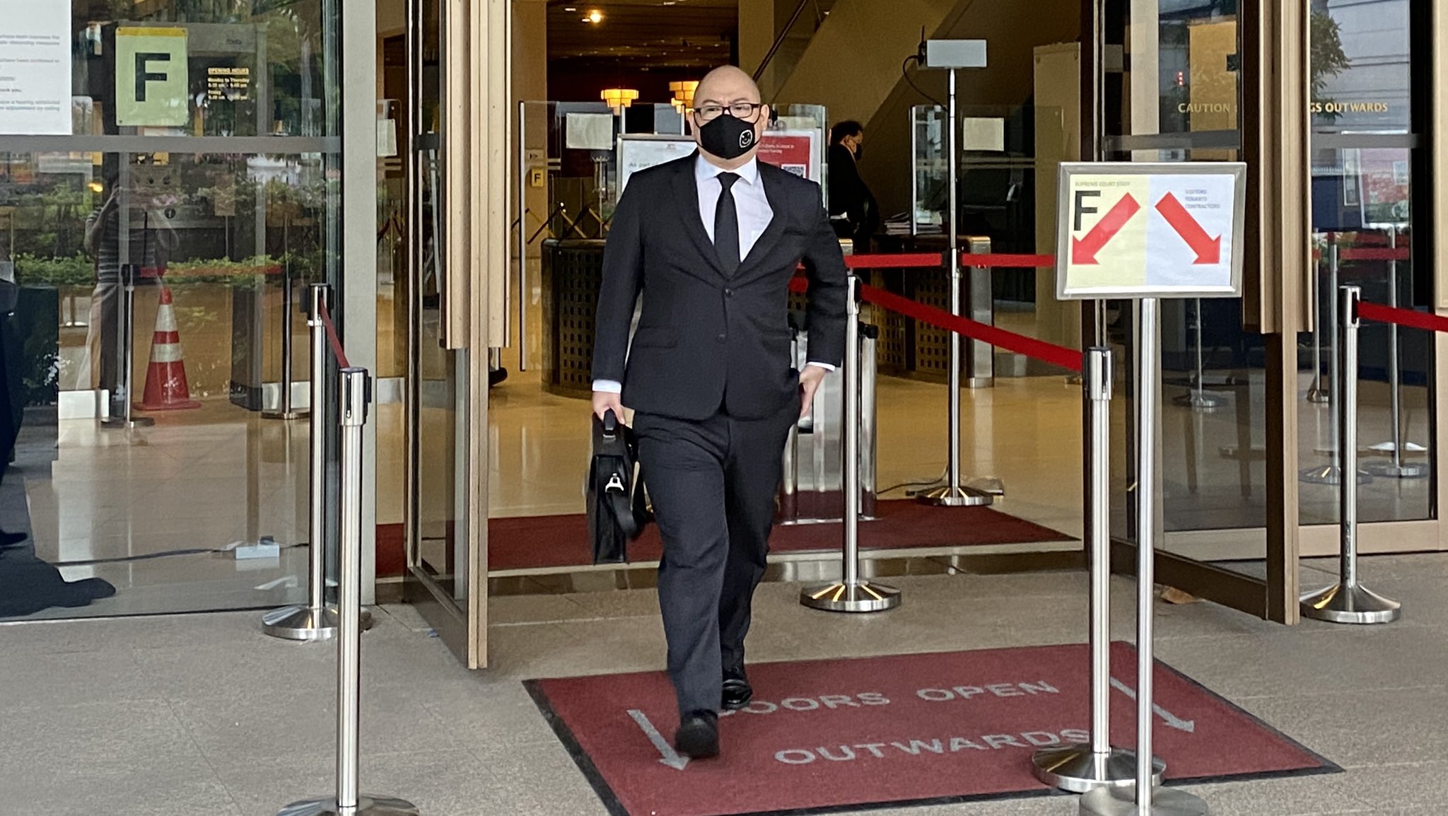 The Online Citizen editor Terry Xu walks out of the Supreme Court building on Nov. 30, 2020. Photo Carolyn Teo/Coconuts